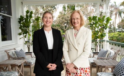 Two women smiling at the camera